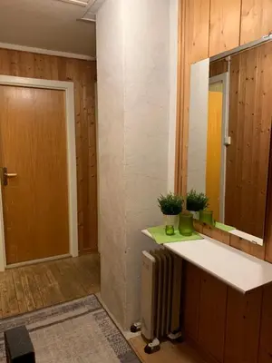 a room with a counter and a mirror and a door at Sjarmerende overnatting sentralt i Vest-Telemark in Høydalsmo