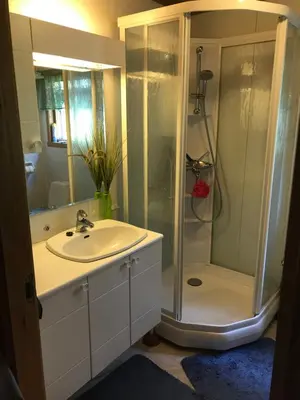 a bathroom with a sink and a shower at Ferienhaus „Draumen“ in Norwegen in Bømlo