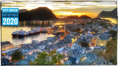 a city center with boats in the water at sunset at Bergvegen Guesthouse Aalesund in Ålesund