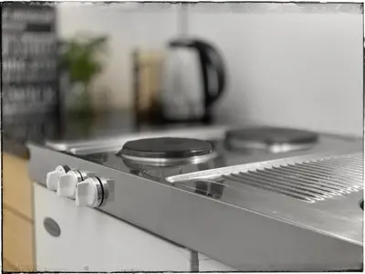 a close up of a stove top in a kitchen at Bergvegen Guesthouse Aalesund in Ålesund