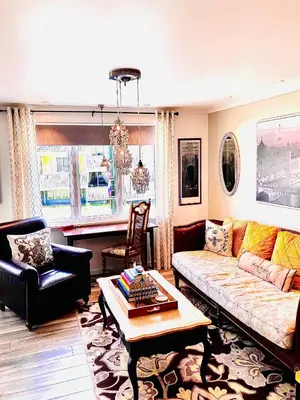 a living room with a couch and a table at Apartments At The Sentrum in Kristiansund