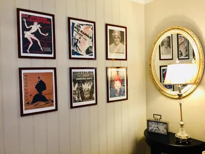 a wall with a bunch of framed movie posters at Apartments At The Sentrum in Kristiansund