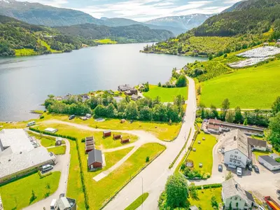 an aerial view of a town next to a lake at Ulvik Camping in Ulvik