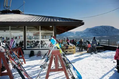 a group of people standing in the snow with skis at Oppdal Alpintun ski in ski out in Oppdal