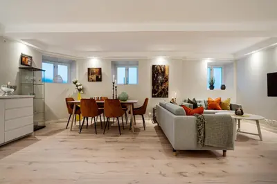 a living room with a couch and a table at Keyser Apartments 8 in Bergen