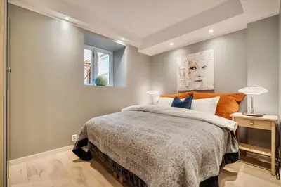 a bedroom with a large bed and a window at Keyser Apartments 8 in Bergen