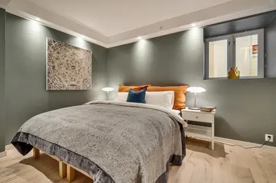a bedroom with a large bed and a window at Keyser Apartments 8 in Bergen