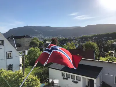an american flag flying on top of a house at # 1 Mountain View with free street parking in Bergen
