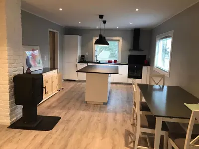 a kitchen and living room with a table and a dining room at # 1 Mountain View with free street parking in Bergen
