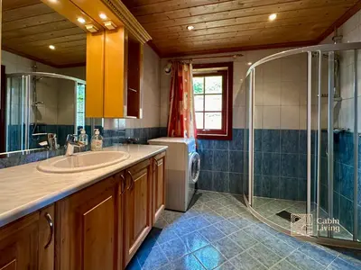 a bathroom with a sink and a shower at Large Cottage 2 Baths and Sauna in Sjusjøen in Lillehammer