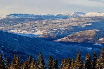 a view of a valley with snow covered mountains at Large family cabin in Hafjell ski in-out, BBQ, terrace and fireplace in Hafjell