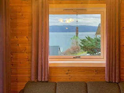 a window in a room with a view of the water at 6 person holiday home in Brekke in Brekke
