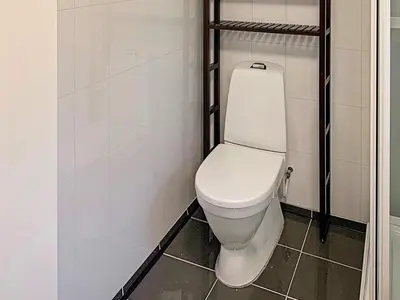 a bathroom with a white toilet in a room at 6 person holiday home in Brekke in Brekke