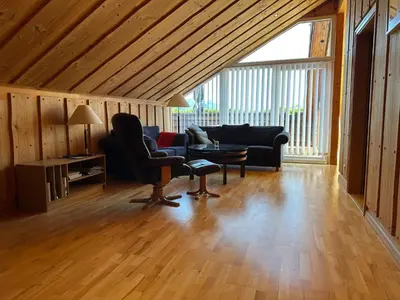 a living room with a couch and a table at 6 person holiday home in EIDSVÅG-By Traum in Eidsvåg
