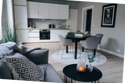 a living room with a couch and a table at Odda Apartments - 2BR & 3BR - Parking - T32 in Odda