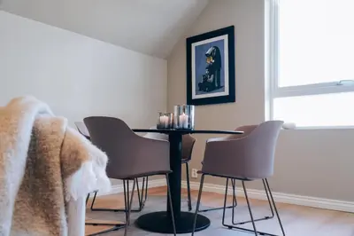 a dining room with a table and chairs at Odda Apartments - 2BR & 3BR - Parking - T32 in Odda