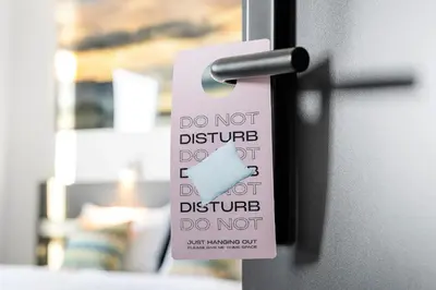 a do not disturb sign on a door at Aiden by Best Western Trondheim Airport in Stjoerdal