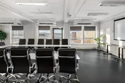 a conference room with a long table and chairs at Aiden by Best Western Trondheim Airport in Stjoerdal