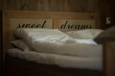 a bed with the words support dreams written on it at Dale-Gudbrands Gard by Frich`s in Sør-Fron