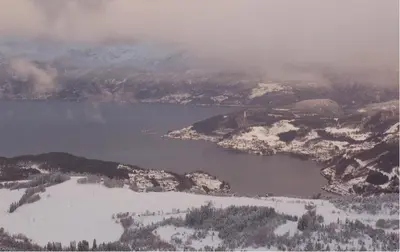 an aerial view of a lake in the snow at Hardanger Feriesenter Sjusete in Norheimsund