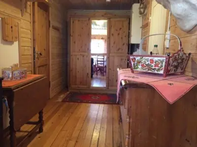 a kitchen with a counter and a door to a room at Hardanger Feriesenter Sjusete in Norheimsund