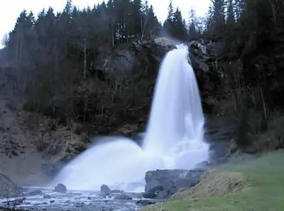 a waterfall on the side of a river at Hardanger Feriesenter Sjusete in Norheimsund
