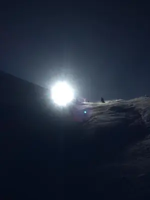 a light on top of a snow covered slope at night at In the middle of Trysilfjellet - Welcome Center - Apartment with 3 bedrooms - By bike arena and ski lift in Trysil