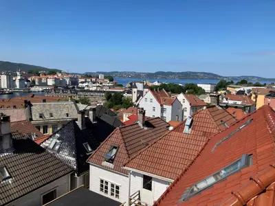 an aerial view of a city with roofs at Skansen Apartments in Bergen