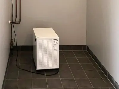 a heater sitting on a tiled floor in a room at 6 person holiday home in Kverva in Dyrvik