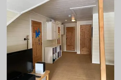 a hallway of a house with wooden doors at Comfortable house in quiet area in Luster
