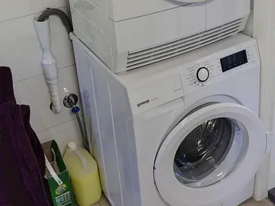 a washing machine with a microwave on top of it at 10 person holiday home in Stordal in Stordal