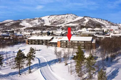 a city in the snow with a red arrow at Beste beliggenhet på Geilo. in Geilo