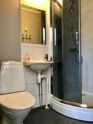 a bathroom with a toilet and a sink and a shower at Private apartments!Oppdal Alpintun, Skisenter-Stølen in Oppdal
