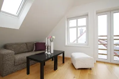 a living room with a couch and a table at Villa Skansen in Bergen