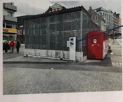 a building with a gate on the side of a street at Villa Skansen in Bergen