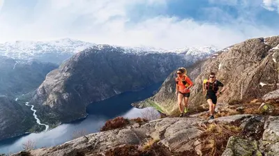 a man and woman walking on top of a mountain at Vestly in Etnesjøen