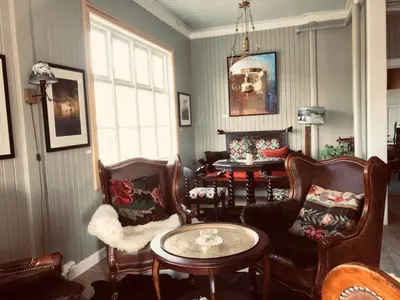 a living room with chairs and a table at Jotunheimen Arctic Domes in Beitostøl