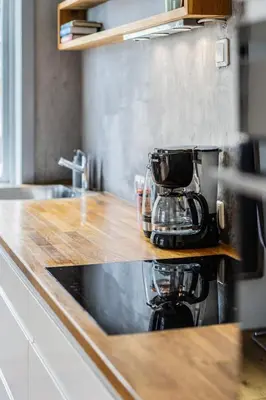 a kitchen counter top with a coffee maker on it at Cozy apartment in Alesund city in Ålesund