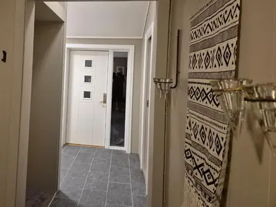 a hallway with a door leading into a room at Utleiebolig Fannrem in Fannrem