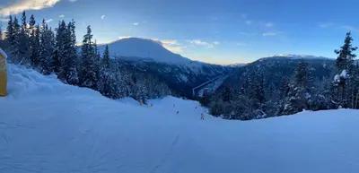 a group of people skiing down a snow covered mountain at Villa Rjukan in Rjukan