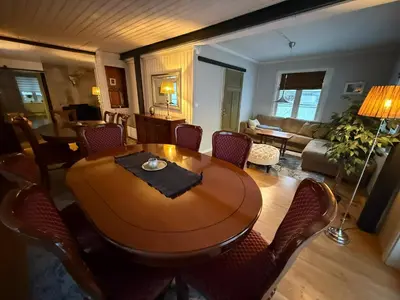 a living room with a wooden table and chairs at Villa Rjukan in Rjukan