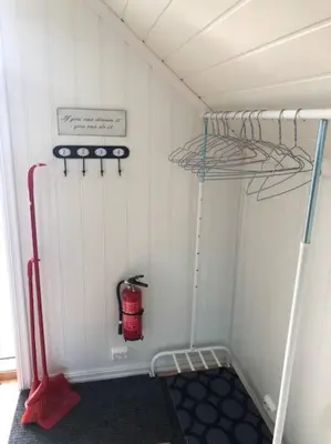 a small room with a fire hydrant in the wall at Koselig garasjeloft! in Holen