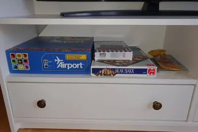 a white drawer with boxes on top of it at Fantastic and high standard apartment in Nordseter in Lillehammer