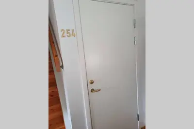 a white door with the number on it at Fantastic and high standard apartment in Nordseter in Lillehammer