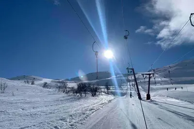a ski lift on top of a snow covered slope at Super sentral, flott og solrik leilighet i sentrum in Hemsedal