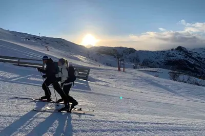 two people on skis on a snow covered slope at Super sentral, flott og solrik leilighet i sentrum in Hemsedal