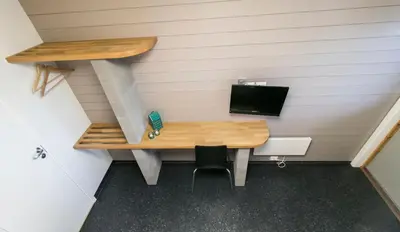 a room with a desk with a phone on it at Hamar Vandrerhjem in Hamar