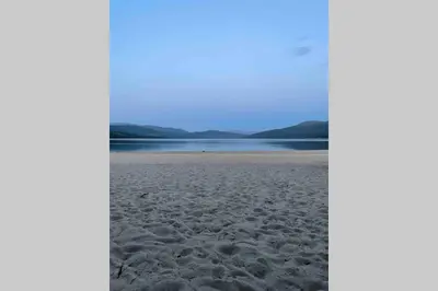 a view of the beach at dusk at Fjellro Mountain Cabin in Oppdal