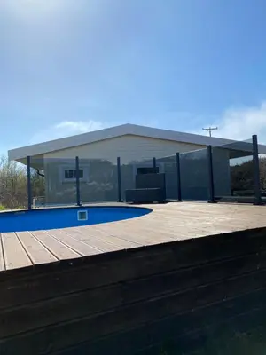 a house with a pool and a pavilion at Feriehus med Sjøutsikt in Sætra
