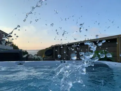 a splash of water in a swimming pool at Villa with jacuzzi in Nord Bjørøy